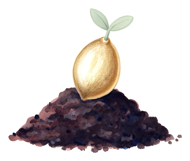 A painted golden seed resting on a mound of earth, with a small green shoot beginning to grow.